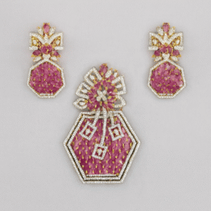 Ruby Renaissance Hexagon Pendant and Earrings Set by Risha Fine Jewels featuring ruby-pink CZ stones in a mosaic design with gold-plated detailing, displayed on a black background.