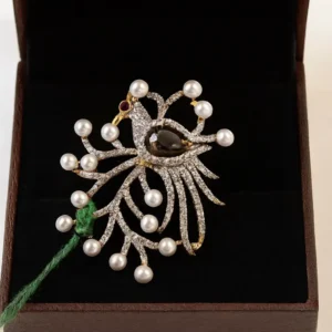 Gold-plated designer brooch with pearl studs and sparkling CZ diamonds in an elegant floral pattern displayed in a jewellery box