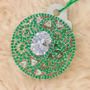 Elegant Oval CZ Centerpiece Pendant with Green Crystal Detailing – Designer Round Filigree Pendant Featuring Sparkling White Oval Stone, Green CZ Embellishments & Intricate Craftsmanship by Risha Fine Jewels.