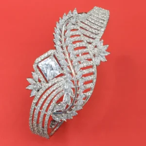 Eternal Leaf Shine CZ Statement Bracelet with Princess-Cut Center Stone in White-Gold Finish – Intricate Leaf Motif Designer Bangle by Risha Fine Jewels.