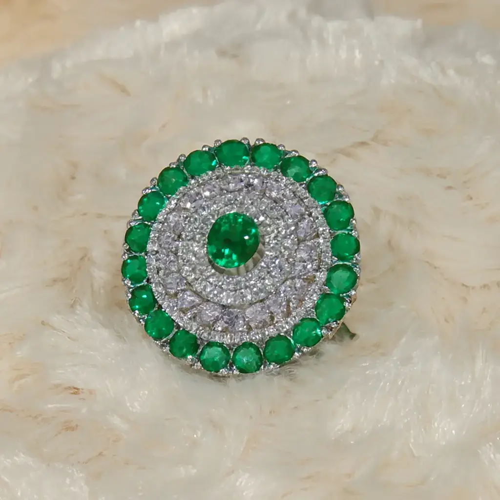 Premium Emerald-Green Stone Halo Cocktail Ring for Women Premium emerald-green stone halo cocktail ring with double CZ halo and silver-plated finish by Risha Fine Jewels.