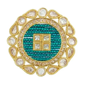 Regal Emerald Beaded Round Statement Ring with CZ Halo in Gold-Tone Finish by Risha Fine Jewels placed on a blue velvet box.