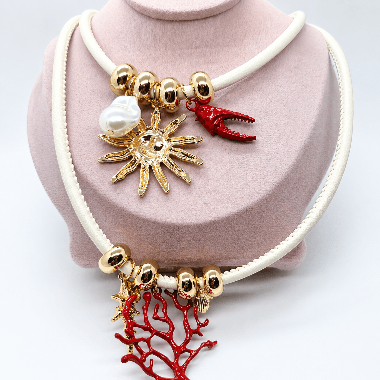 Ocean Charm Statement Necklace – Gold-Plated Beads, Pearl, Coral & Sun Pendant Designer Artificial Jewelry